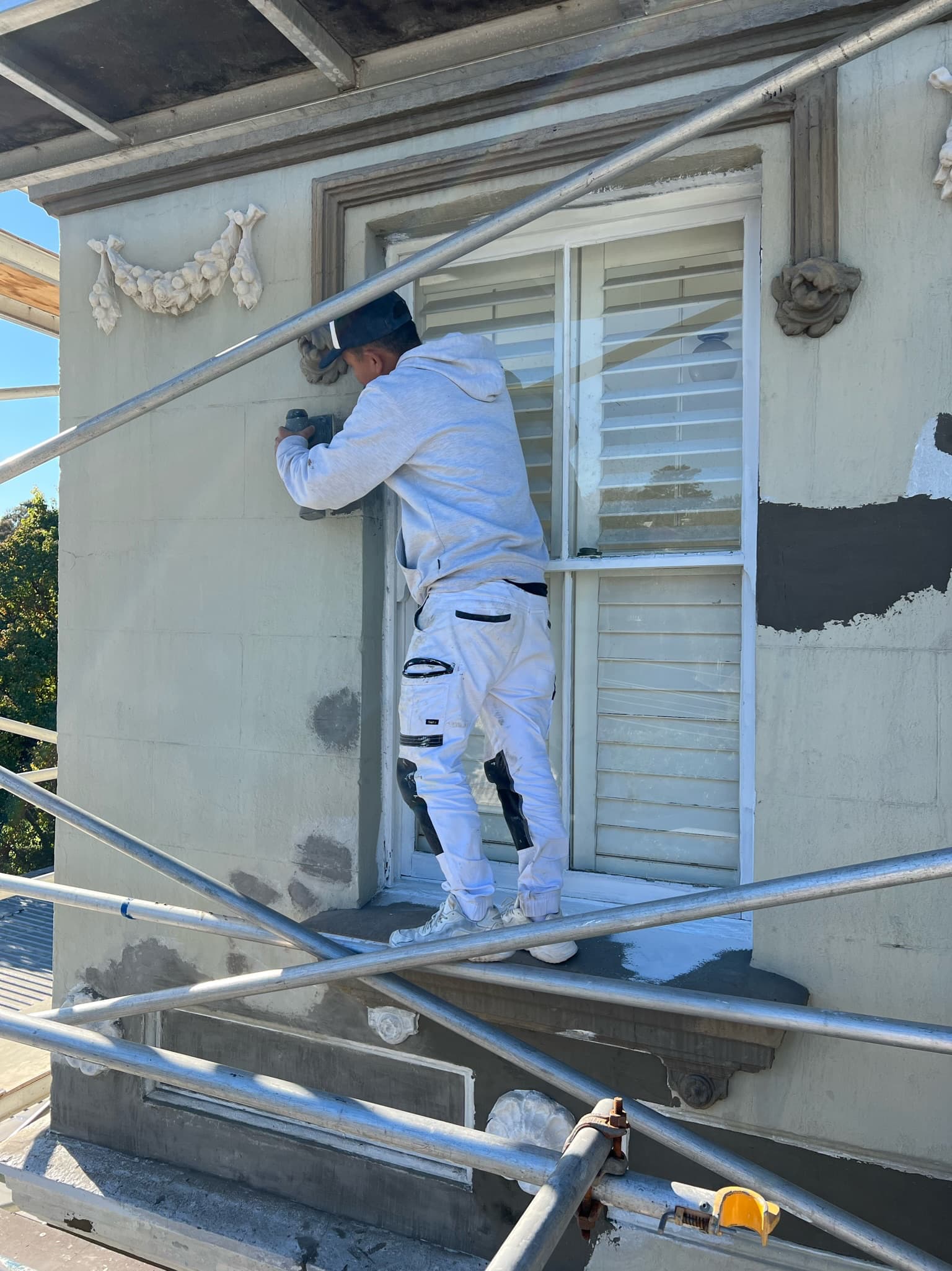 Roberts Trading painter preparing exterior render
