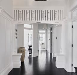 Painted white hallway with dark timber floors